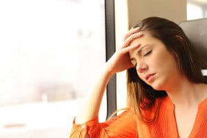 Woman experiencing migraine headache