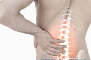 Man experiencing lower back pain causes