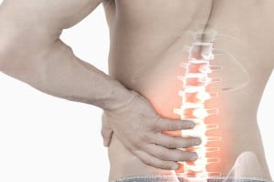 Man experiencing lower back pain causes
